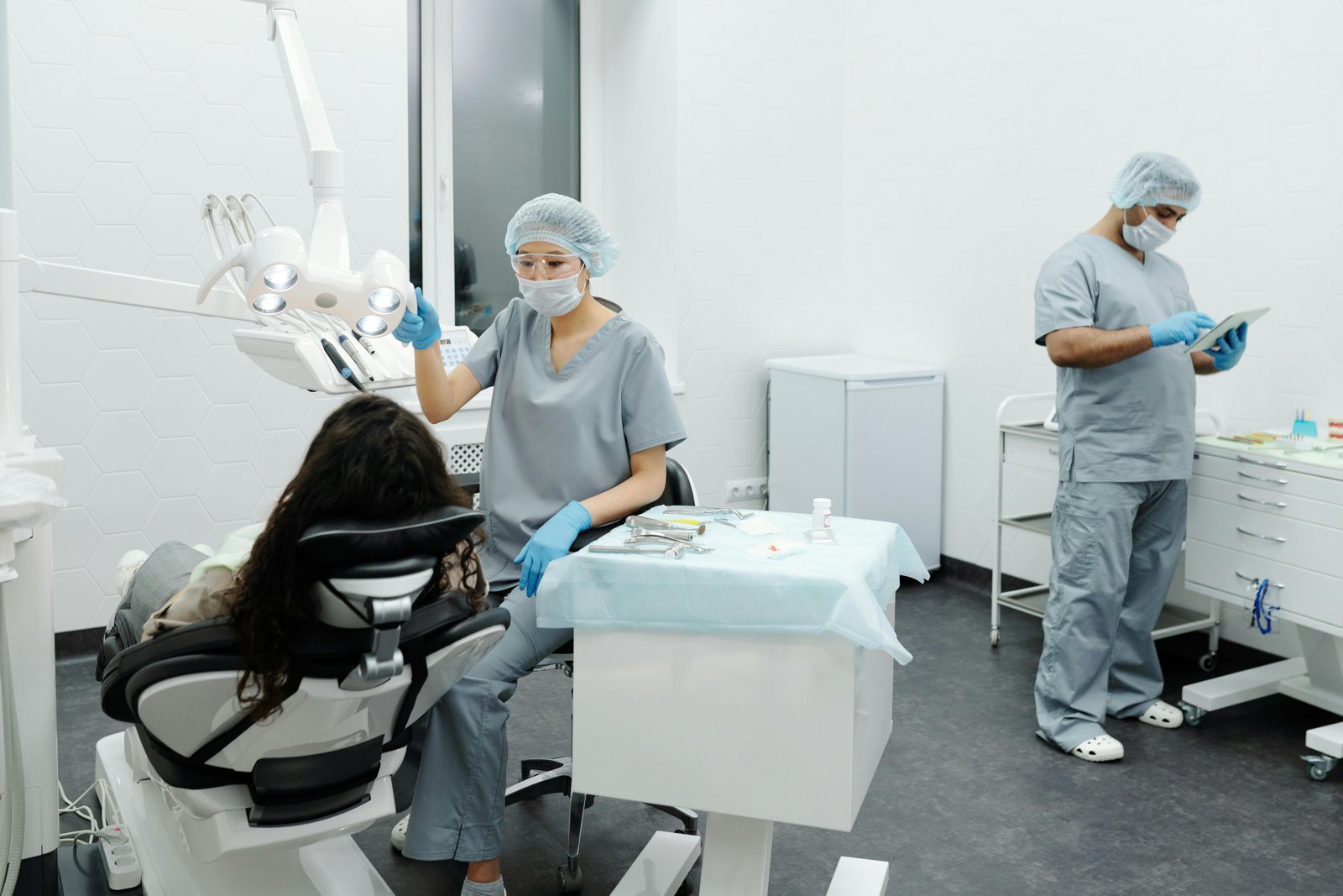 Dental professional preparing in clinic