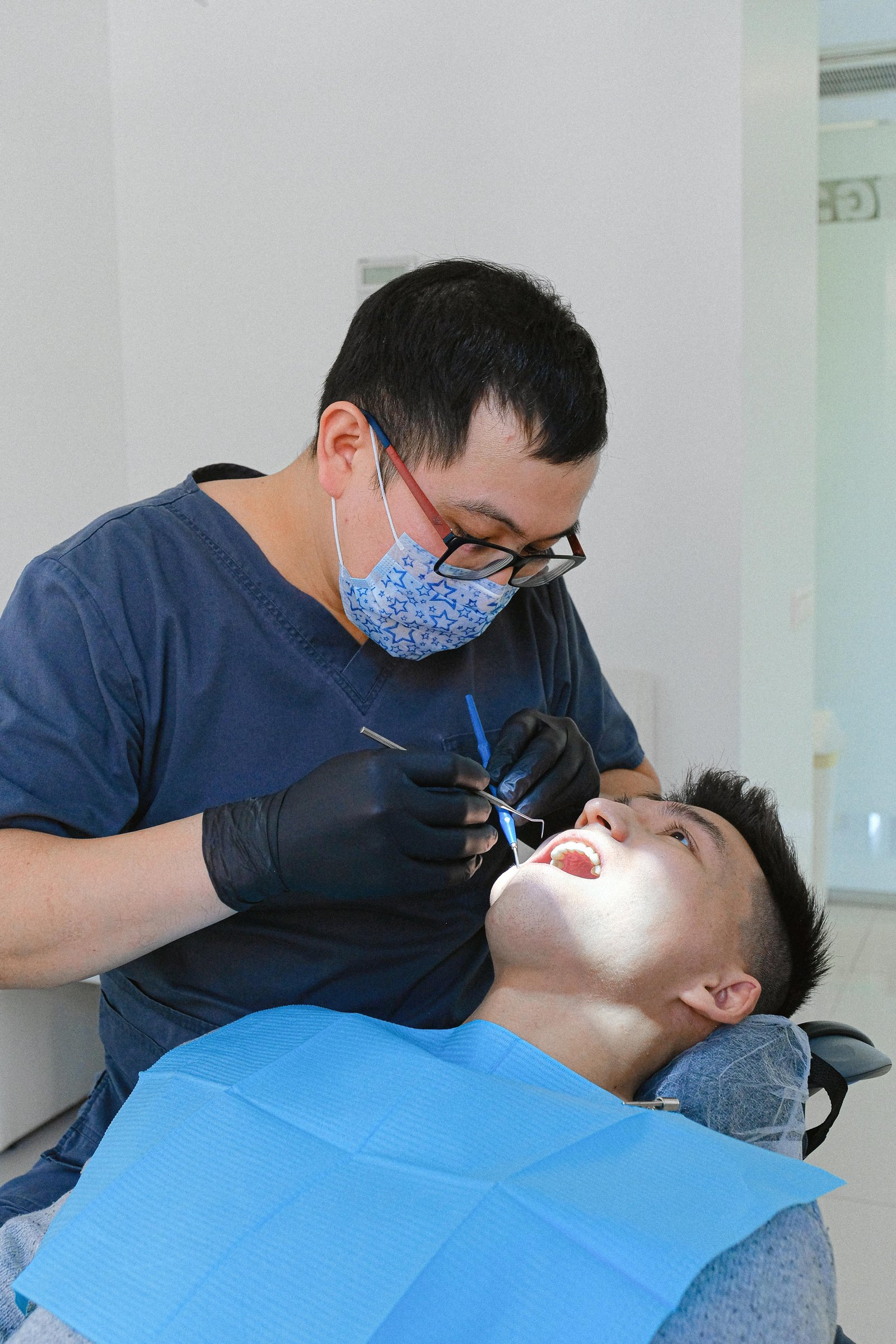 Dental professional consulting a patient